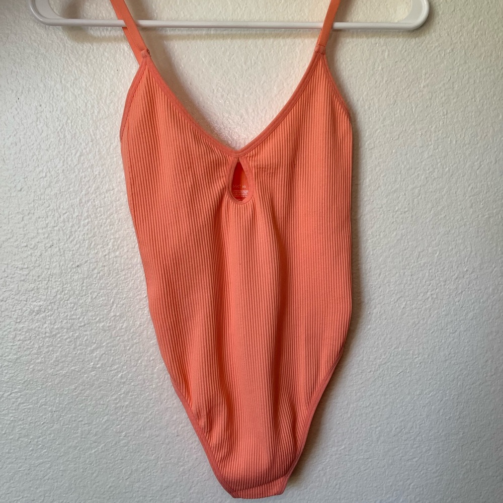 Brand new never worn orange bodysuit